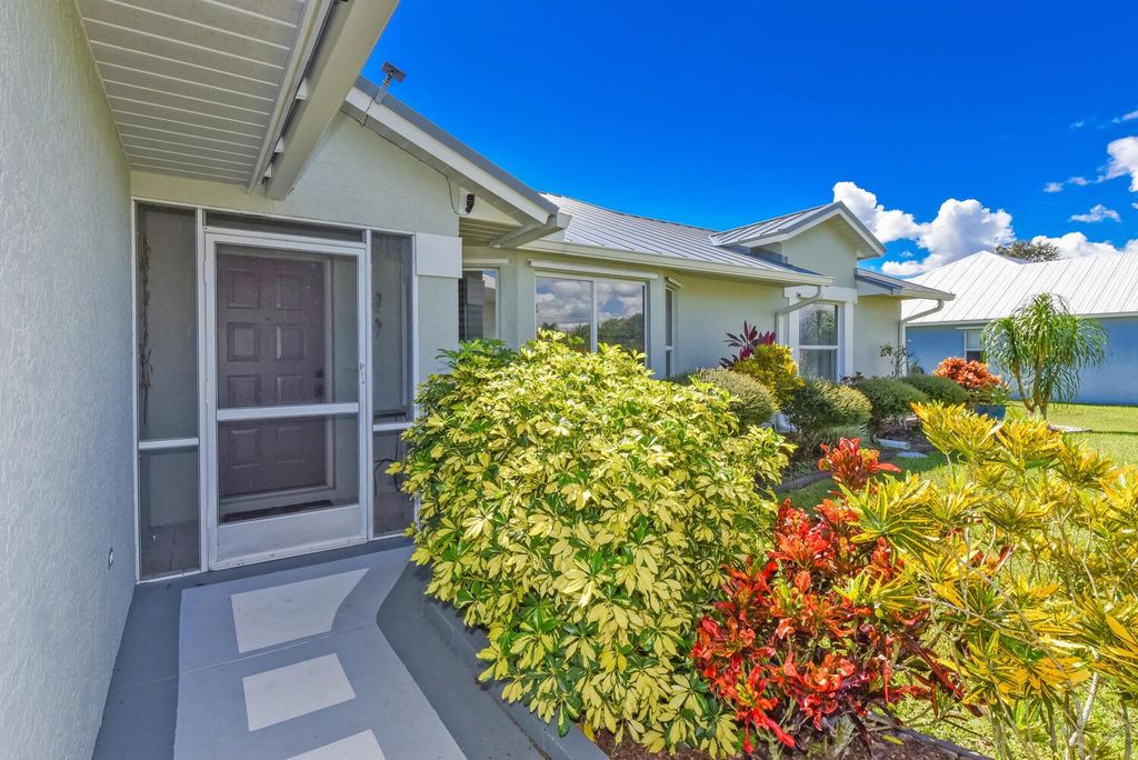 Photo of 6831 NW Hogate Circle, Port Saint Lucie, FL 34983 (MLS # R11135068)