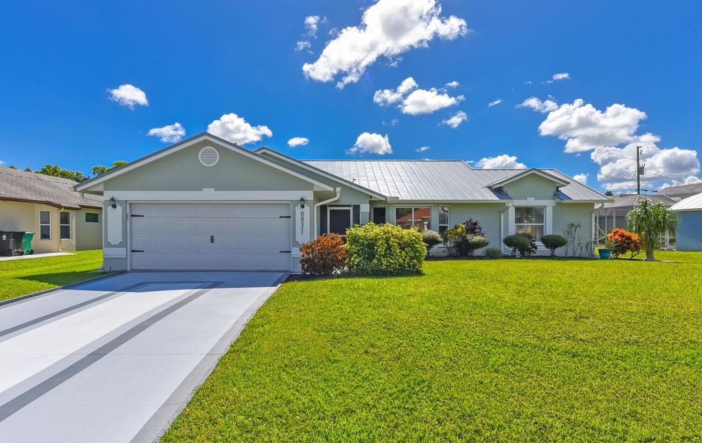 Photo of 6831 NW Hogate Circle, Port Saint Lucie, FL 34983 (MLS # R11135068)