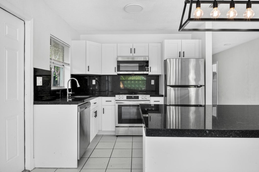 Photo of 1515 NW 8TH Avenue, Fort Lauderdale, FL 33311 (MLS # B26081020)