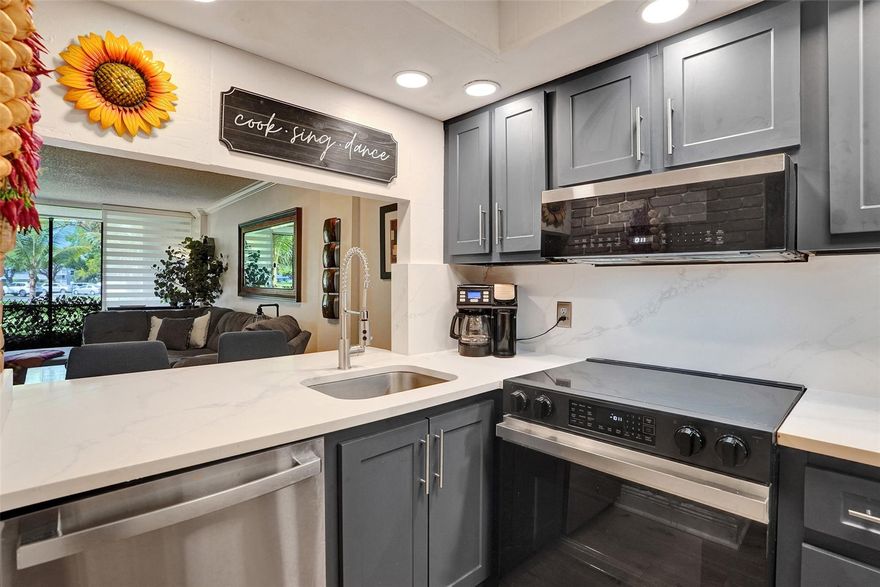 SELLER SAYS SELL NOW! MOVE-IN READY FIRST FLOOR UNIT. Secure, gated, Pet friendly(no weight limit) community of Royal Park in Oakland Park, this recently renovated 1-bedroom, 1.5-bathroom condo offers a harmonious blend of modern upgrades like quartz counters, matching backsplash, crown molding, Plantation Shutters, ceiling fans, new water-resistant laminate floors in kitchen and LR, Tile in Bath, and new carpet in BR. Newer IMPACT WINDOWS AND IMPACT FRONT DOOR. Accordion shutters on patio, modern ceiling fans in BR and LR. Brand new Stainless Steel appliances. The Garden View provides a peaceful retreat with convenient access to Wilton Manors, Las Olas, Restaurants, Shopping, the Pomp, and the beaches. RARE OPPORTUNITY NOW