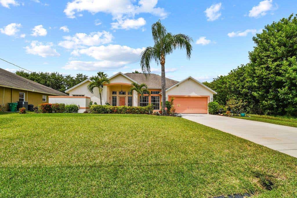 Photo of 2266 SW Monterrey Lane, Port Saint Lucie, FL 34953 (MLS # R10797127)