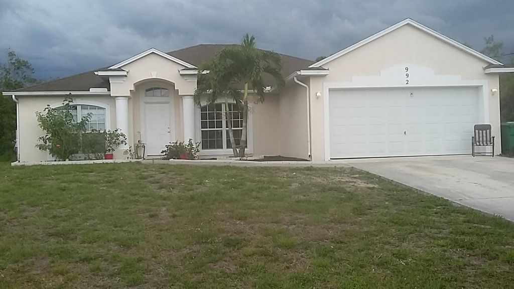 Photo of 992 SW Mccomkle Avenue, Port Saint Lucie, FL 34953 (MLS # R11115091)