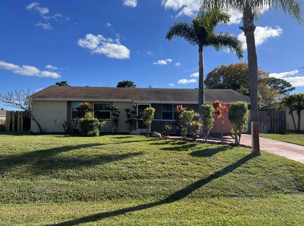 Photo of 450 SW Dagget Avenue SW, Port Saint Lucie, FL 34953 (MLS # R10965331)