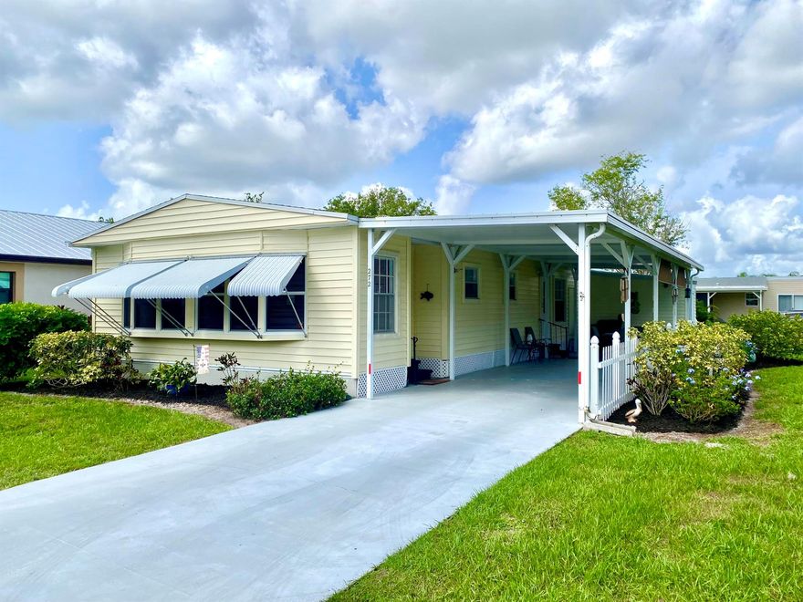 Move-in ready home conveniently located on a corner lot at the beginning of the neighborhood.  Bright and inviting with crisp white walls throughout.  Washer/Dryer located in huge walk-in master closet makes laundry a breeze.  Large, open living area with furnishings available.  Nice landscaping and extra storage available in shed.  Large covered carport with pull down shades & big enough for two vehicles.  All information to be verified by the buyer.
