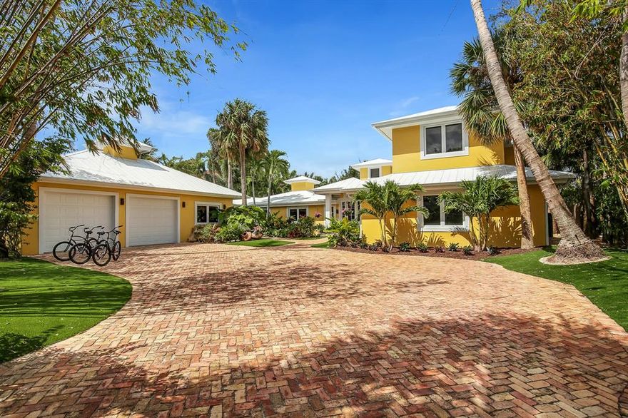 Stunning 2 story 4 BR/4.5 BA estate on the sparkling turquoise waters of the Intracoastal Waterway in prestigious JIC. View of the historic Jupiter Lighthouse from your lush tropical backyard...with the ocean and private beach just steps from your front door. Room for up to 80' vessel along with 24,000 lb lift on 104' of water frontage with direct ocean access. Over 5,500sf of flowing interior space plus oversized a/c garage with full private gym. Patios and porches for outdoor living and entertaining. Natural coral stone flooring, beautifully crafted Driftwood kitchen and bar room with Miele and Subzero appliances, gas fireplace, high vaulted cypress tongue and groove ceilings and serene European edge pool. Come...make this home your private oasis & enjoy the lifestyle you've earned!