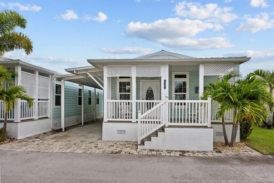 Light, bright, and move-in ready! This 2-bedroom, 2-bathroom home offers 1,105 sq. ft. of stylish living space built in 2017, featuring an open floor plan and beautiful wood-look tile flooring throughout for a cohesive and modern look. The kitchen showcases warm wood tone cabinetry, creating a welcoming and timeless feel.Enjoy your morning coffee or evening breeze on the charming front porch or take advantage of the prime location -- just a 30-second walk to the pool, gym, sauna/steam room, and bar! You can also walk or bike to downtown Jensen Beach to explore its restaurants, shops, and waterfront charm.Sitting on one of the largest lots in the community for this size home, there's potential to add a back patio or deck (with HOA approval). The current owner