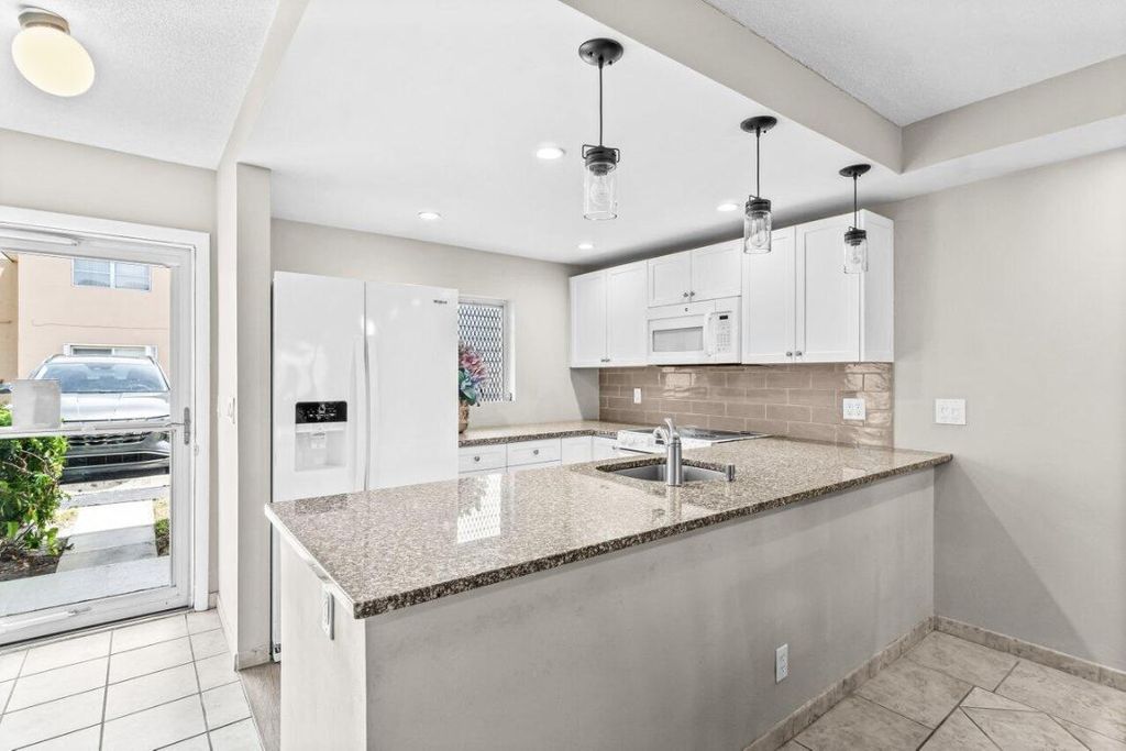 Photo of 2191 NE 1st Court #Apt 106, Boynton Beach, FL 33435 (MLS # R11120385)