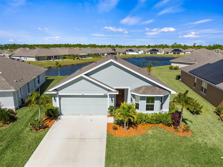 Welcome to this beautiful lakefront home nestled within the Waterstone community. This  home boasts 1,500 square feet, featuring three bedrooms and two  bathrooms split plan, providing both comfort and privacy. Step outside and behold the  views of the serene lake just beyond your doorstep, creating a picturesque backdrop for peaceful mornings and captivating sunsets. The open-concept floor plan seamlessly integrates the living, dining, and kitchen areas. Stainless steel appliances, ample cabinetry, and a spacious island for casual dining. Outside, your private outdoor oasis awaits, offering the perfect setting for entertaining guests or simply unwind. Residents of Waterstone enjoy access to a plethora of community amenities, including sidewalks, recreational facilities, pool & more.