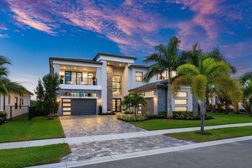 Presenting a modern lakefront estate with panoramic long lake views. Undoubtedly the BEST southern exposure lot in the prestigious Boca Bridges with endless unobstructed long lake views. Introduced by an Impressive approach, the architectural elements of this roughly 6,000 SF Contemporary Riverside are simply stunning. Open sightline's entice you as you take in the grandeur of the open concept dining and family rooms that adjoin the impressive kitchen. Exceeding the expectations of any gourmet chef with its impressive offerings of Wolf, SubZero and Bosch appliances. The tranquil transitions from room to room continue to showcase the one of a kind striking coffered ceiling details, extensive millwork, custom built-in's and the 80 bottle wine showcase.
