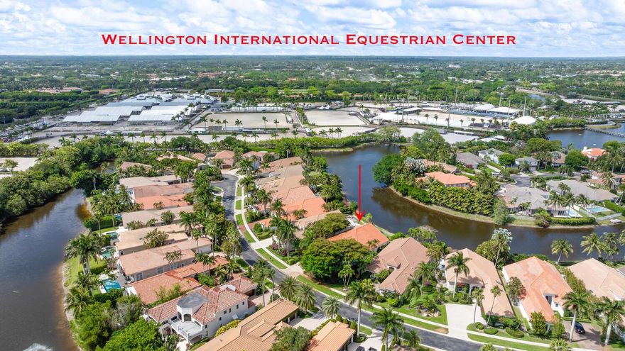 Located in the prestigious Equestrian Club Estates, this refined residence offers an unparalleled lifestyle just steps from the Wellington International showgrounds--one of the closest residential locations available to world-class equestrian competition. This elegant single-story home features soaring ceilings, a spacious split-floorplan, and light-filled living areas that open to a private pool and tranquil water views. The home includes three generously sized bedrooms, an elegant office, a well-planned kitchen, and a three-car garage. Nestled within one of Wellington's most exclusive gated communities, this property blends luxury living with unmatched convenience for those seeking immediate access to the heart of Wellington's premier equestrian scene.