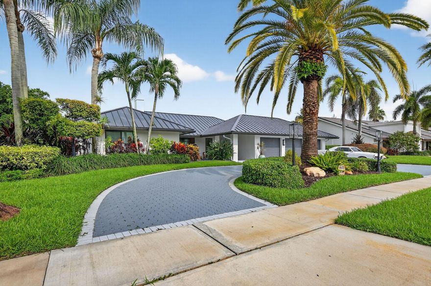 Welcome to a completely renovated 4 bedroom, 4 bathroom , with  builti-in wood appointed den/office a  luxurious and opulent home. New  metal roof and all new hurricane doors and windows. Top of the line Kitchen appliances, walk-in pantry. home has  open spaces with abundant natural light.throughout. Perfect for entertaining.  smashing views of the golf course, walking  distance to  all club amenities. boca woods is a boutique style community that offers a members-only golf, tennis, pickleball and country club amenities. Bring your most special  buyers!