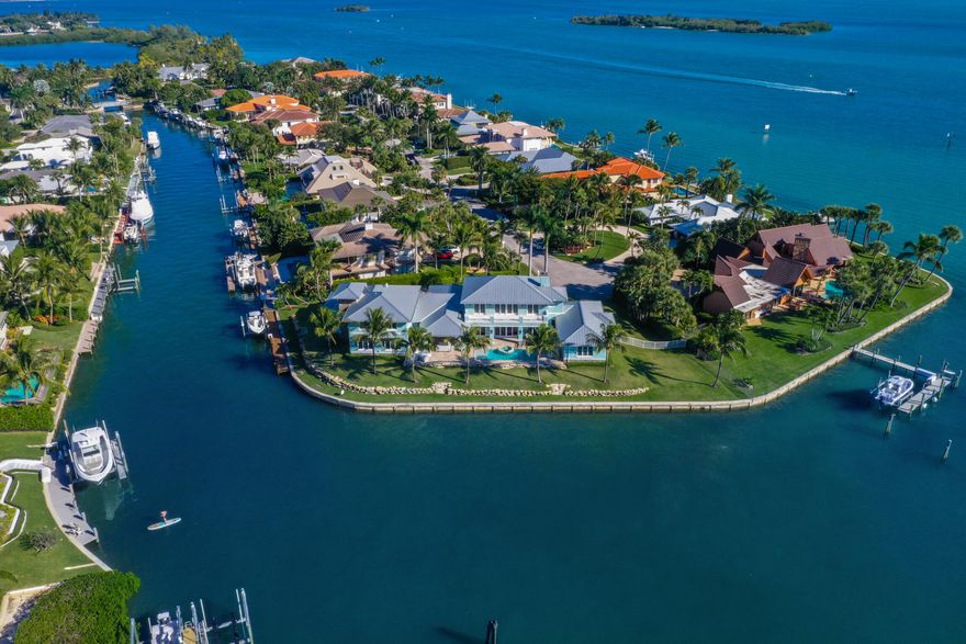 Iconic Sewalls Point Waterfront Estate'' on .60 acres comes to market spanning 308 feet of turquoise blue waters! One of Stuart's best kept secrets and located just north of Palm Beach, Sewalls Point is its own barrier island located between the St. Lucie River and the Indian River Lagoon in Martin County, FL. It's the ''sister'' island to Jupiter Island. Sewalls Point protects the wildlife we love and is also considered a ''Bird & Tree'' Sanctuary. No wonder we have been recognized as Coastal Living's happiest seaside town. If fishing and boating is your passion then come on! Current dock allows for up to a 70' boat and minutes from the inlet. Enjoy sunrises to sunsets on this point lot! This stunning Coastal-Hampton's inspired home features 8,112 total square feet 5 bedrooms, 4 baths, and 3 half baths with stunning game/family room on the second level with 180 degree panoramic water views! Custom kitchen with Sub Zero & Wolf appliances. Whole house generator, impact glass & more!