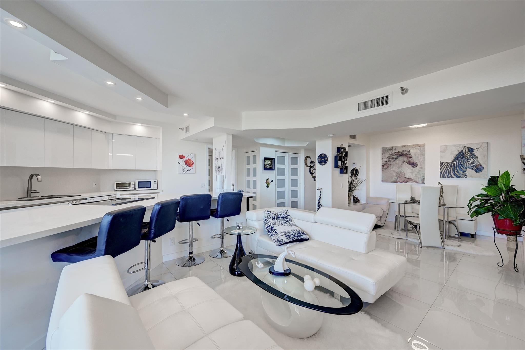 Looking for luxury living, impact windows and stunning water views look no further. This beautiful 2 bed 2 bath washer/dryer in unit, and cover garage is located in the heart of Aventura. Living room features floor-to-ceiling windows, allowing natural light to illuminate in, while the tray ceiling adds an elegant touch. Kitchen is equipped with high-quality white cabinetry, light countertops, and modern appliances, ideal for culinary enthusiasts. Upscale tile throughout and so many more upgrades. The Primary bedroom features multiple windows, walk-in closet, a specious bathroom with double sinks, tub and shower. This beauty features a private balcony with breathtaking water views and endless sunsets. Resort-style amenities; pool, gym, 24-hr security & direct access to Waterways Marina.