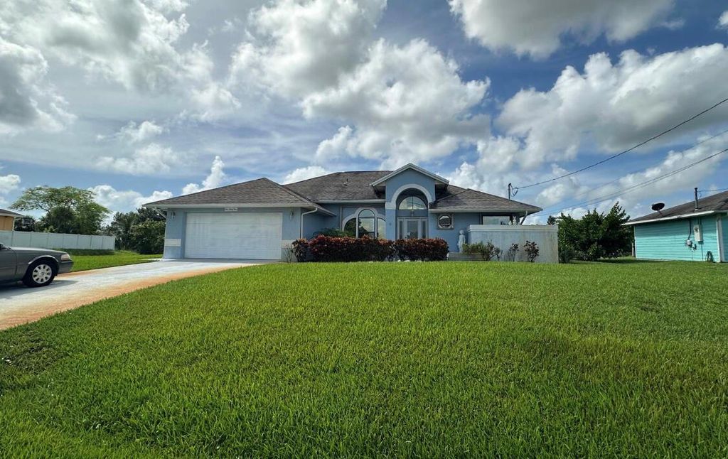 Photo of 434 SW Jeanne Avenue, Port Saint Lucie, FL 34953 (MLS # R11009474)