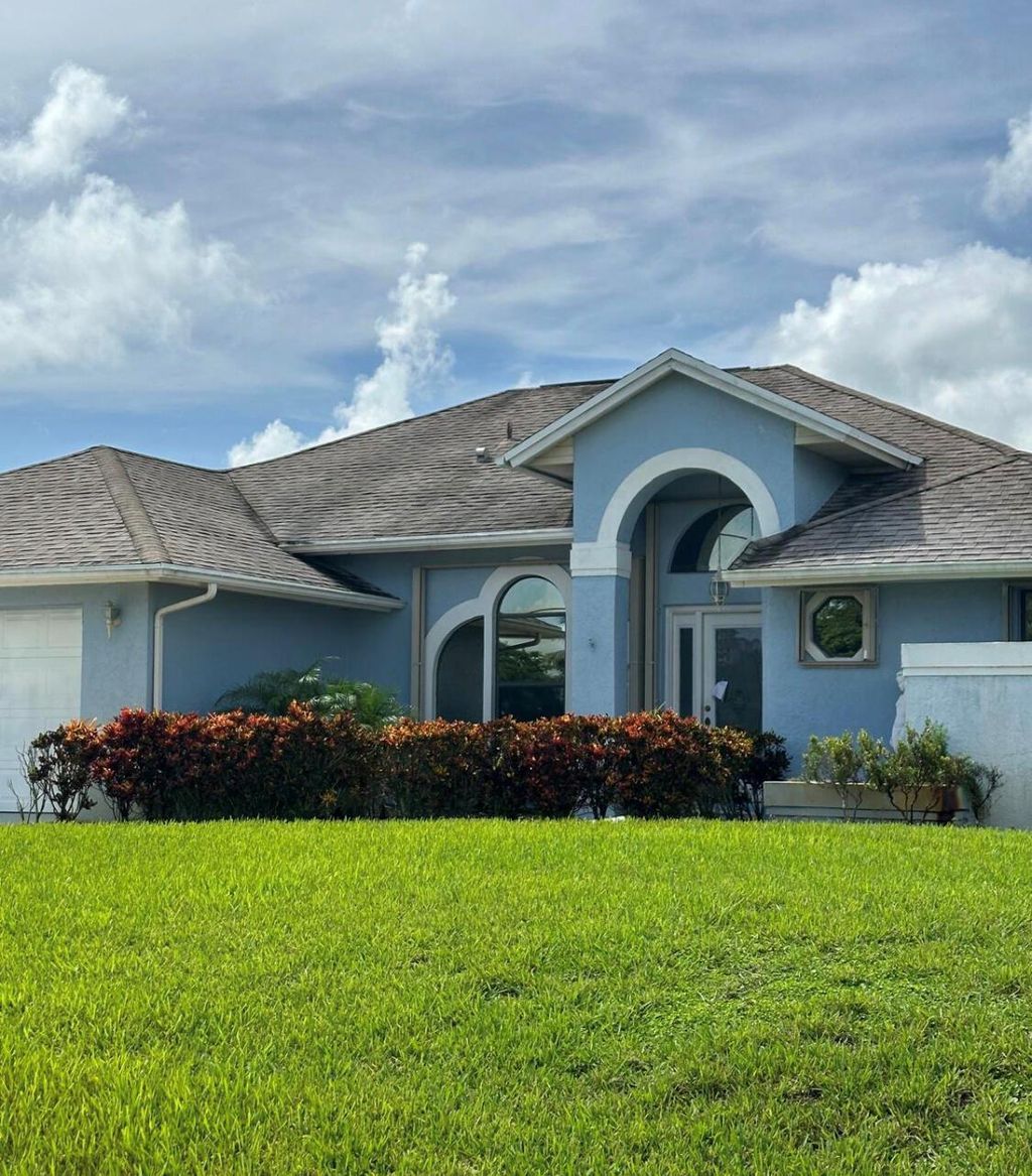 Photo of 434 SW Jeanne Avenue, Port Saint Lucie, FL 34953 (MLS # R11009474)