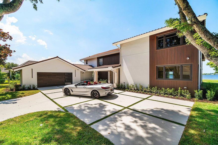 Do Not Miss this fully renovated 4 bedroom 4.5 bath home in the Gated community of the Land of the Presidents. 5,032 SQFT of elegance and luxury with long lake views from almost every room in the house. This is the fun house with a putting green, fire pit, summer kitchen and large pool all overlooking the lake. All 3 upstairs bedrooms have a private balcony and the Primary bedroom has a sitting room/ office space, a beverage center, a huge walk- in closet and an oversized bathroom with beautiful lake views and towel warmers. The large and beautiful kitchen has Thermador Stainless Steel appliances, a large island with waterfall edges, a dining nook and a walk in pantry. The large Family Room is open to the kitchen and pool and features a wet bar with a wine cooler and ice maker. Roof