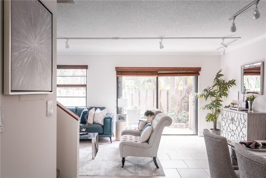 Gorgeous 2 bedroom, 2.5 bathroom townhouse in a professionally managed and beautifully maintained community. Enjoy updated finishes including a modern kitchen, tiled floors, full washer dryer, tankless water heater, walk-in closet in master bedroom, bonus room/office/dining area, and a private back patio. This hidden gem is nestled in a charming neighborhood with tree-lined streets. Walk to Wilton Drive, five minute drive to Downtown Fort Lauderdale, and ten minutes to the beach. The community features a clubhouse, gym, and pool. HOA fee includes common area maintenance & insurance, cable t.v. and high speed (fiber) internet. 2 designated parking spaces. No pet restrictions! Very healthy HOA with fully funded reserves. FHA approval likely. Motivated Sellers! Make an offer!