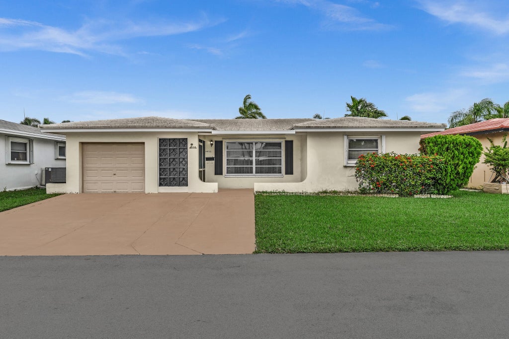 Photo of 4202 NW 43rd Terrace, Tamarac, FL 33319 (MLS # B26091998)