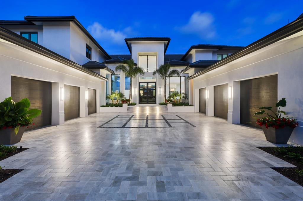 Entering this home will take your breath away! This totally renovated home with dramatic open spaces and soaring ceilings offers water views from almost every room. located in prestigious Admirals Cove.It boasts 10,235 square feet under air, 5 bedrooms,, hurricane impact windows & doors, lavish master suite w sitting room, wide plank imported hardwood floors in every room. The gourmet chefs kitchen features beautiful cabinetry and top of the line appliance, wolf stove, subzero refrigerator, oversized pantry.Paradise awaits the moment you enter the backyard. you will be greeted by resort style living that includedan expansive loggia, full summer kitchen w pizza oven, euro edge infinity pool & spa, fireballs, fire pit,110 feet of water frontage accommodates an 80 ft boat