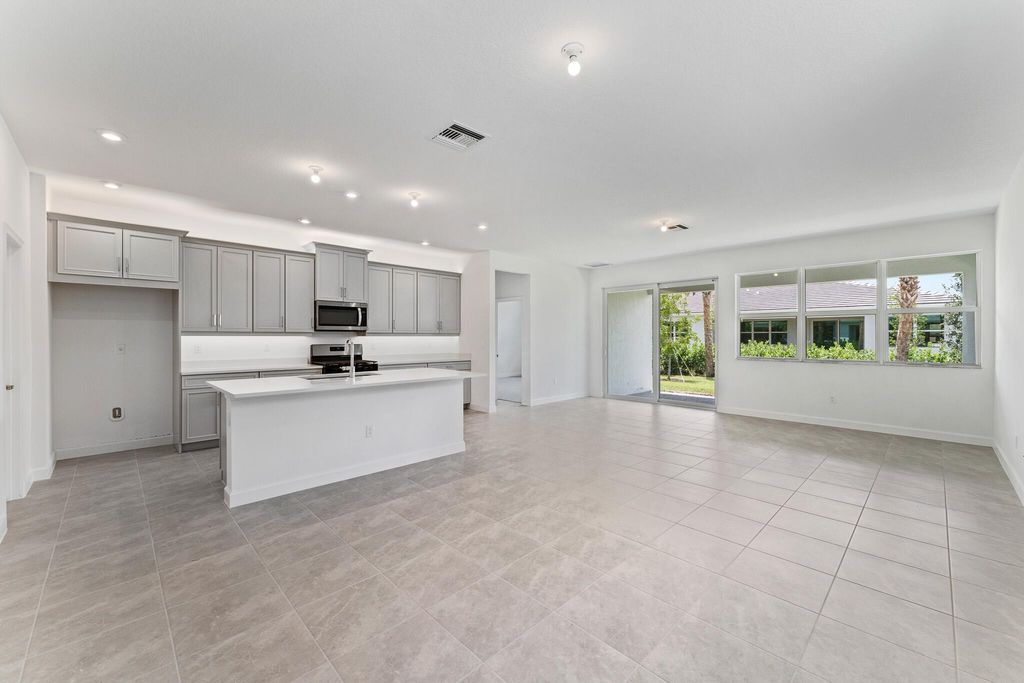 Photo of 9858 SW Veronese Drive, Port Saint Lucie, FL 34987 (MLS # R10986013)