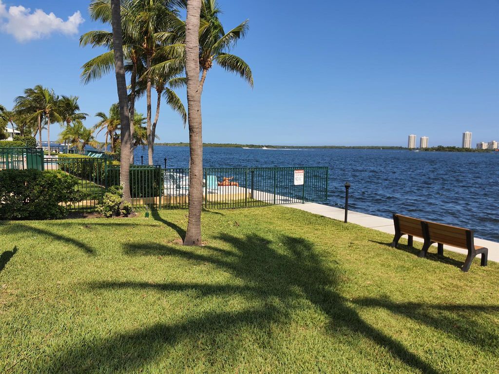 Photo of 1050 Lake Shore Drive #205, Lake Park, FL 33403 (MLS # R11008433)