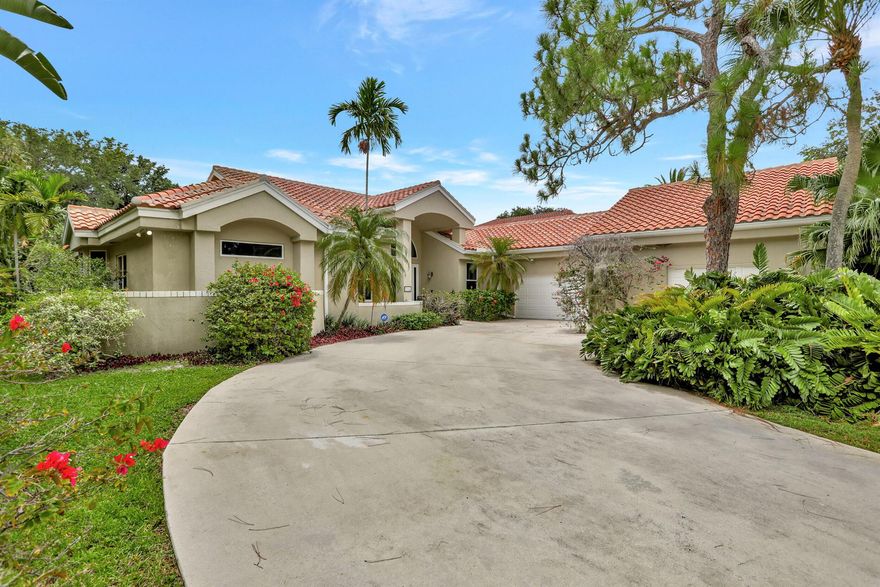 ONE OF A KIND PROPERTY WITH OCEAN ACCESS ! This very spacious and oversized lot offers 100 ft of waterfrontage on the Hillsboro Canal in EAST BOCA. Only minutes to some of the  best beaches in Palm Beach Co. and all ''A'' rated schools this 4 bedroom, plus office,  5 bath home sits in the prestious neighborhood of Palm Beach Farms.  Beautiful native trees and lush landscaping sideline this exquisite private ESTATE, offering NEW ROOF, 2016,  IMPACT WINDOWS AND SLIDERS, 3.5 TON AC UNITS, 2018,  AND 80 GAL. 3 YEAR NEW WATER HEATER.  Plenty of room for extra cars with added garage space and a full walkup attic storage area and contrete safe room. As you enter this home you are immediately met with 12' ceilings and open  views of the lush backyard from the large living area and office.