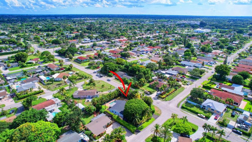 Located minutes to Downtown West Palm Beach, This Turnkey Home is Ideally positioned on an Expansive Corner Lot adorned with mature landscaping and spacious 180-degree driveway. Step inside to find an inviting open-concept layout seamlessly connecting the kitchen, dining, and family room areas. The kitchen is adorned with Calcutta Quartz Countertops and Modern Appliances, creating an ideal setting for culinary creations and gatherings. This thoughtfully designed home boasts a Split-Bedroom floor-plan featuring two en-suites alongside an additional bedroom and bathroom. Outside, a screened-in patio offers a tranquil retreat overlooking the expansive backyard, complete with a sizable pool, lush green spaces, and an outdoor showerâ''an entertainer's dream.

Recent updates include a new HVAC system in 2021, a pool heater added in 2023, as well as refreshed doors, trim, kitchen fixtures, laundry facilities, and upgraded appliances. The roof and partial impact windows were also updated in 2017, ensuring both style and efficiency throughout the home.