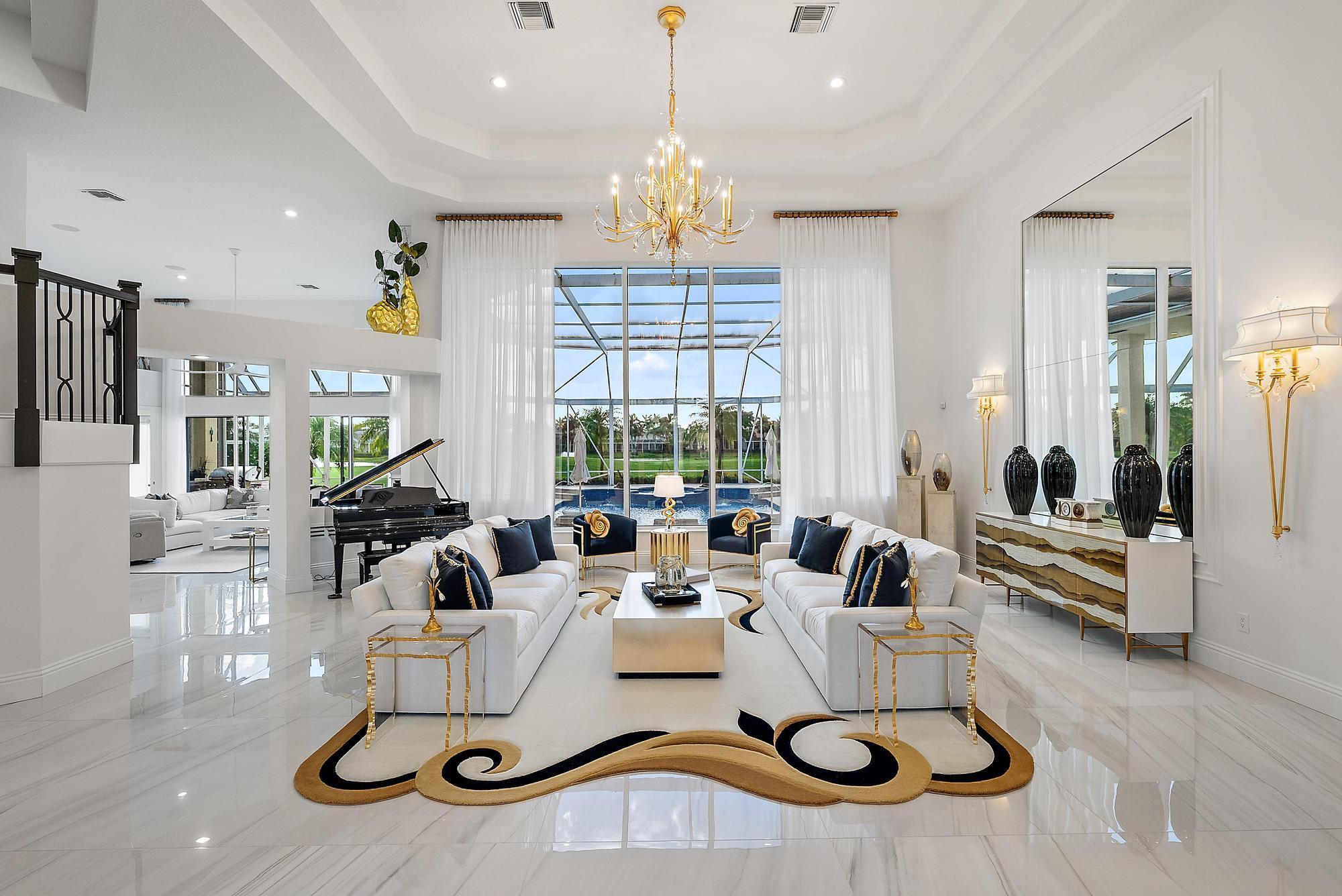 Sophisticated Luxury Estate with Breathtaking Golf & Water ViewsStep into a world of elegance and sophistication the moment you enter this stunningly renovated estate. Designed for those who appreciate the finest in luxury living, this 5-bedroom, 5.5-bathroom masterpiece spans over 5,000 square feet of impeccable living space.From the grand entrance to the soaring ceilings and floor-to-ceiling windows, every detail of this home has been curated for unparalleled style and comfort. The expansive primary suite is a true sanctuary, offering a spa-inspired en suite and breathtaking golf course and water views, setting the perfect backdrop for serenity and indulgence.Exquisite Features & Amenities: