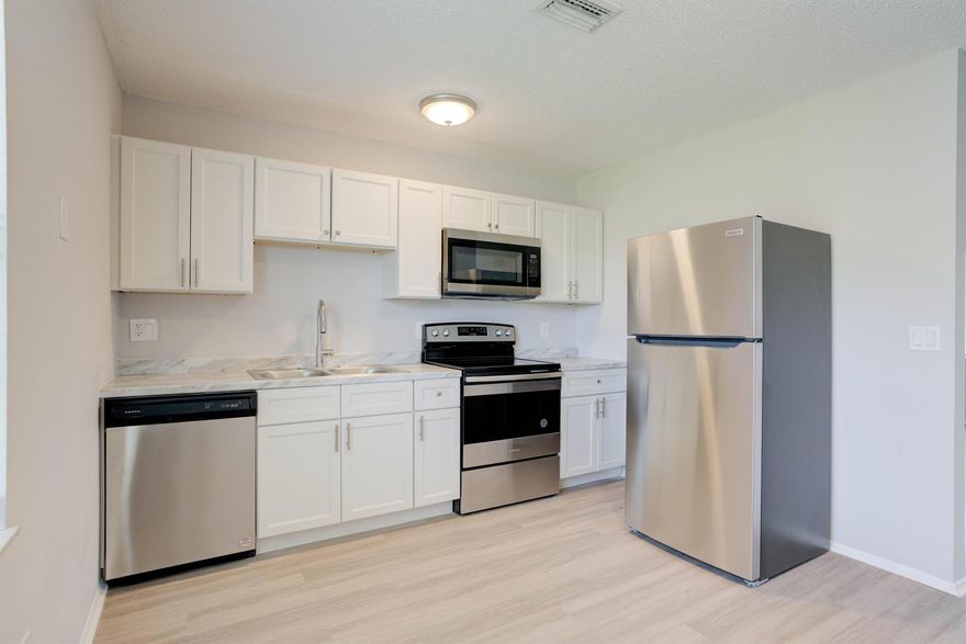 ONE MONTH FREE! Annual/Seasonal/Short Term Options available! Completely Renovated villa with 3 bedrooms & 1 bathroom. YOUR OWN WASHER/DRYER INSIDE UNIT. Brand new kitchen with white shaker custom cabinetry, plank flooring, brand new appliances, new bathroom with custom vanity, new fixtures, all freshly painted thru out. New ceiling fans, built in microwave, stainless steel appliances, washer/dryer. Located 1/4 mile south of Indiantown Road and right off Central Blvd, close to beaches, shopping, restaurants, easy access to 95 and Turnpike