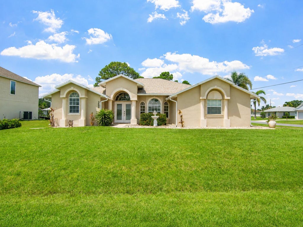 Photo of 3402 SW Edo Street, Port Saint Lucie, FL 34953 (MLS # B26069861)