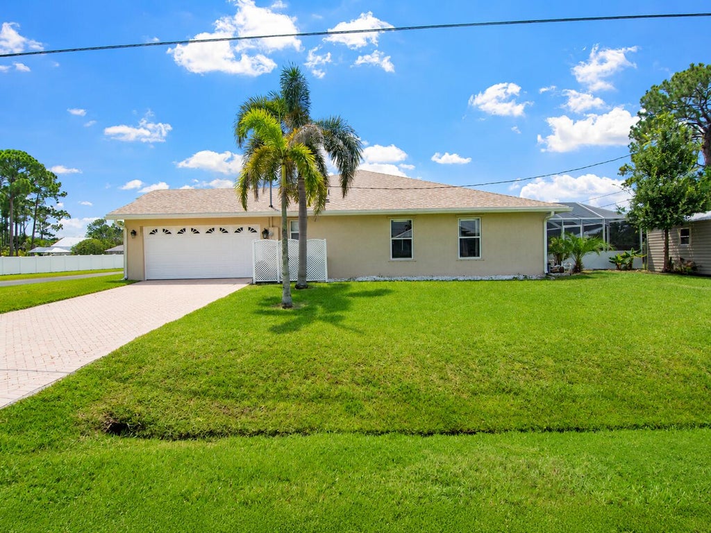 Photo of 3402 SW Edo Street, Port Saint Lucie, FL 34953 (MLS # B26069861)