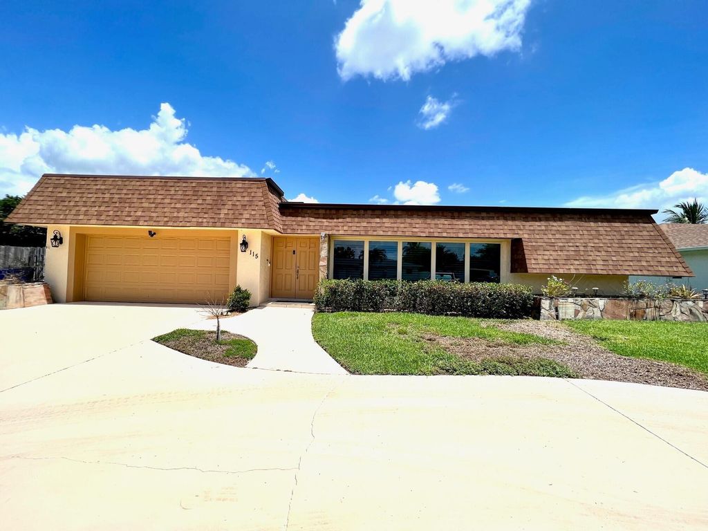 Photo of 115 Sandpiper Avenue, Royal Palm Beach, FL 33411 (MLS # R11095617)