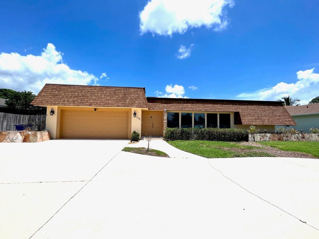 Photo of 115 Sandpiper Avenue, Royal Palm Beach, FL 33411 (MLS # R11095617)