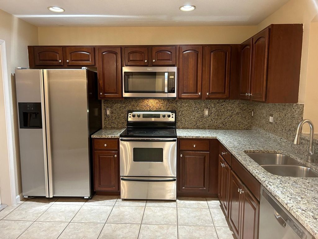 Photo of 6303 Sandy Bank Terrace, Riviera Beach, FL 33407 (MLS # R10897964)