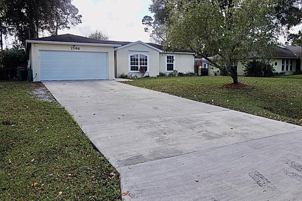 Photo of 1566 SW Janette Avenue, Port Saint Lucie, FL 34953 (MLS # R10766486)