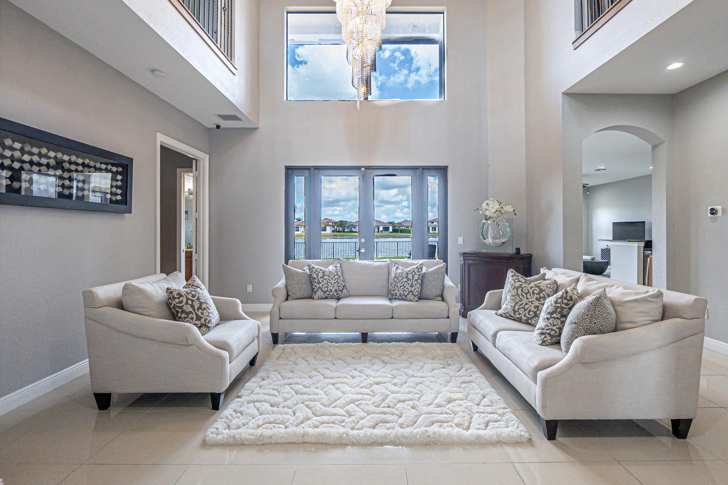 2-story, 5-Bedroom, 4.5 Bath Miralago Home. Recently painted and adorned with updated fixtures, every detail exudes elegance. The expansive Living Room opens to a Lakeview with serene covered Terrace. The gourmet Kitchen boasts upgraded cabinetry, granite countertops, and stainless steel appliances. Downstairs, there is a private Bedroom with Cabana Bathroom which offers retreat.You'll also find a Formal Dining Room, Powder Room, and Game Room. Upstairs enjoy a grand Loft area with Balcony.The Primary Suite features Dual Walk-in Closets, a Marble-Clad Bath, and Roman Tub. Impact Windows/doors, Security System, 24 Hr. Manned Gate, A+ Rated Schools, all provide convenience and peace of mind. Resort-Style Amenities with Sports Complex access.Enjoy the Pinnacle of Parkland living!