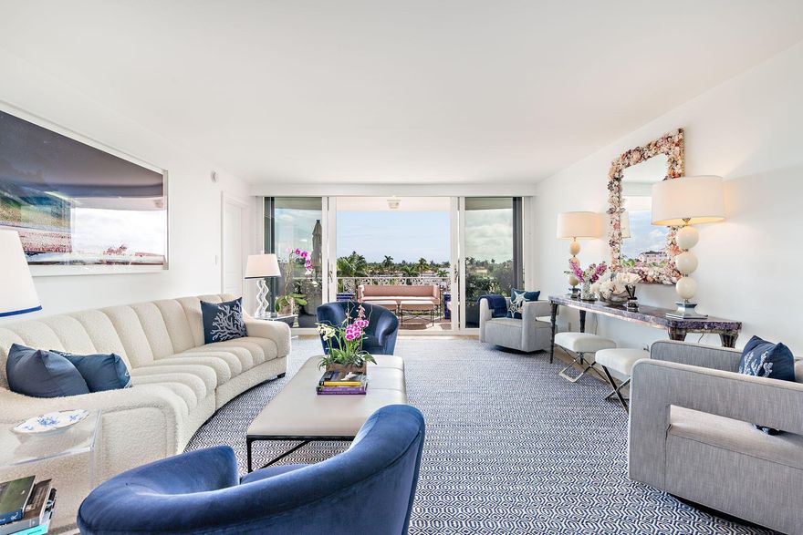 Beautifully renovated top floor apartment in The Melbourne House. Stunning SE & West views overlooking Palm Beach. Covered Parking with 24-hour doorman. Split floor plan. All impact glass windows & doors.