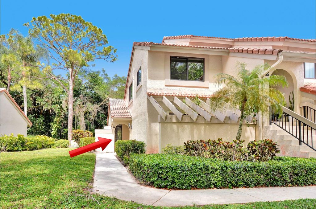 Photo of 5590 Coach House Circle #A, Boca Raton, FL 33486 (MLS # B26019436)