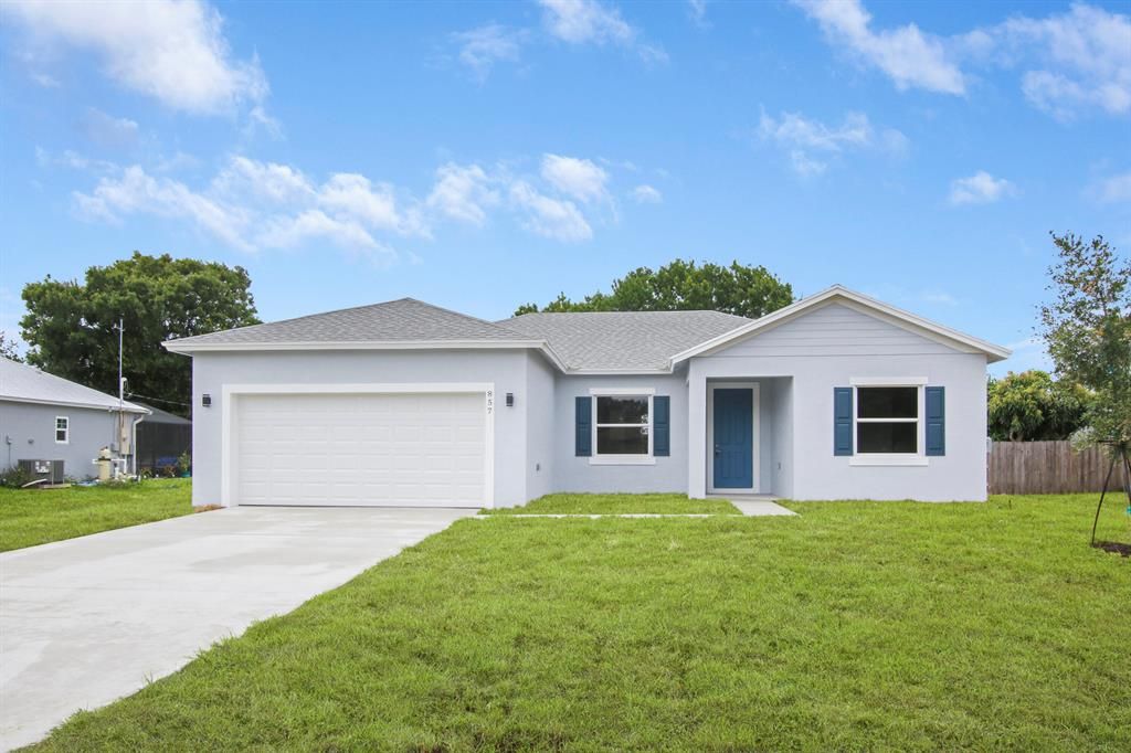 Photo of 857 SE Cavern Avenue Ave, Port St Lucie, FL 34983 (MLS # R10718205)