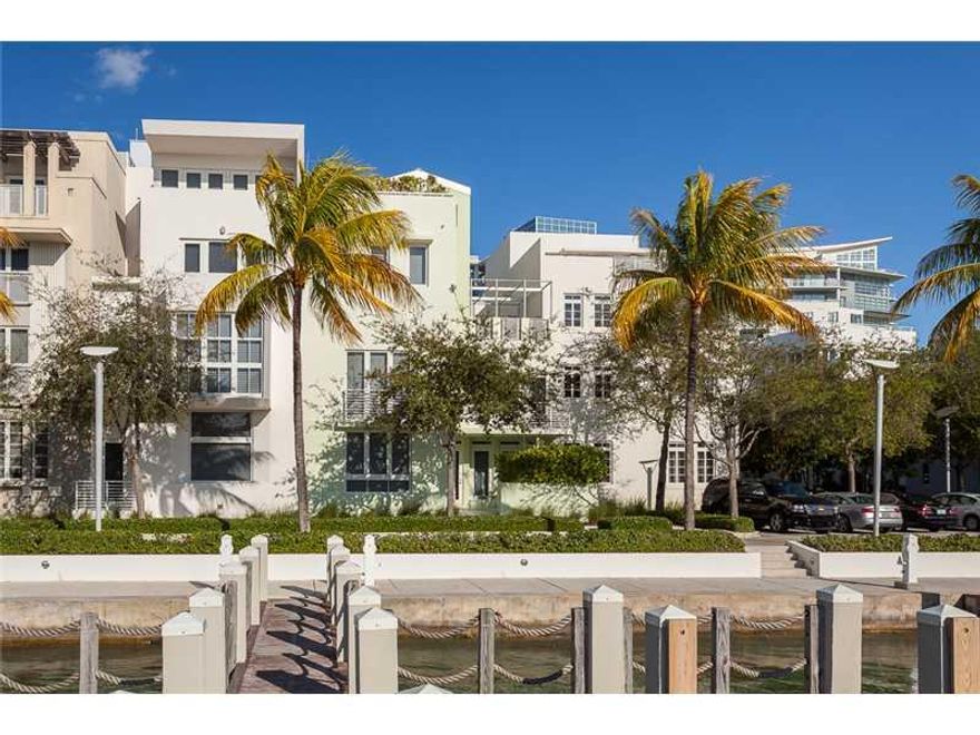 Reduced for Immediate SALE!!!! Rarely available CORNER 4bed/5,5bath+2-car garage and Private ELEVATOR  4 story townhome  with dramatic WATER VIEWS and DEEDED Boat Slip! Best floor plan with 4,584 SQ FT in Allison Island. 12ft ceilings. Large terraces on 2 nd and 4th floors. Luxury kitchen with GAS stove,Sub Zero,Bosch and Thermadore appliances. Designer finishing. Amenities:Gated entrance and Private Security, Valet service, 2 swimming pools, Fitness,SPA, Sauna and children playroom. Close to the Ocean.