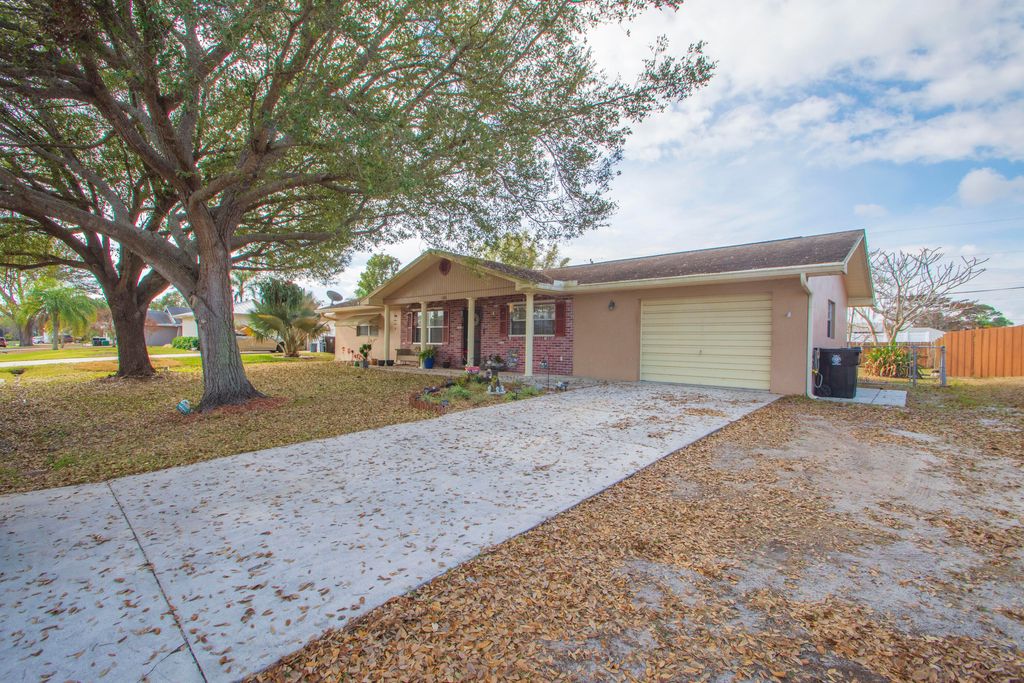 Photo of 1686 SE Biddle Lane, Port Saint Lucie, FL 34983 (MLS # R11165937)