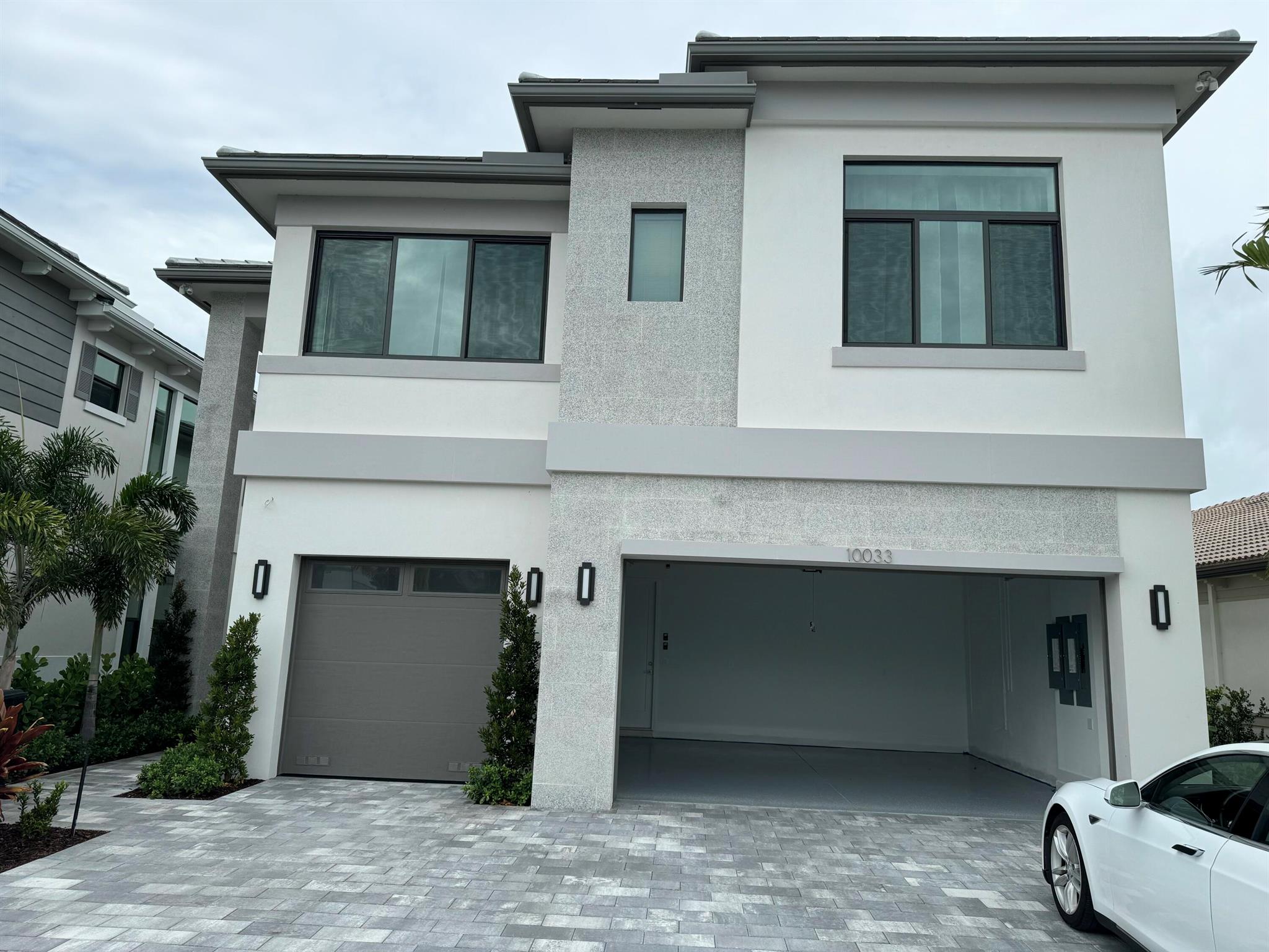 Step into this stunning brand-new 5 BR, 5 Bath home in the heart of the beautiful neighborhood Palm Beach Gardens, complete with a spacious 3-car garage. Every detail is move-in ready , from the whole-house water softener to thoughtfully installed blinds, curtains, and lighting throughout. Enjoy a private balcony with serene lake views, perfect for relaxing or entertaining.Community has many amenities, and they are building a second set of amenities and expected to open by the end of this year. It is closer to the freeway and you are in palm beach gardens.
