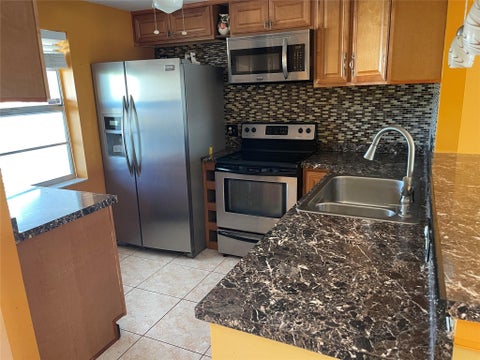 Photo of 1025 Country Club Drive #407, Margate, FL 33063 (MLS # F10529297)