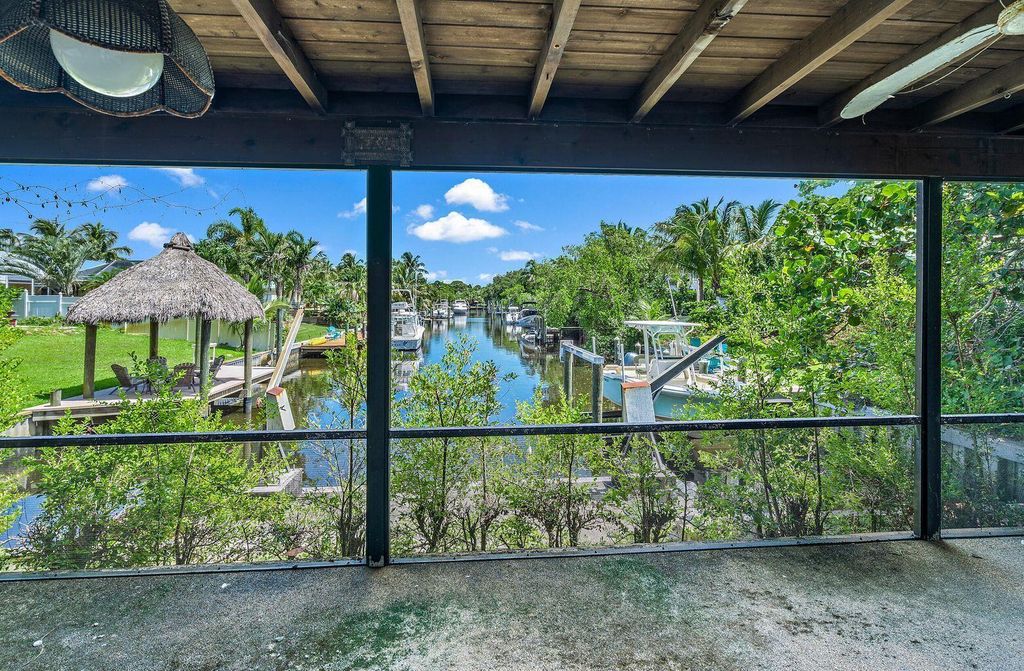 Photo of 2465 Shore Drive Dr, Palm Beach Gardens, FL 33410 (MLS # R10732726)