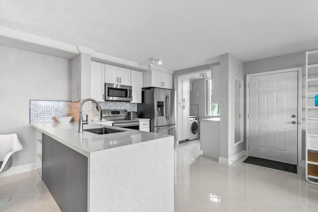 Photo of 180 Yacht Club Way #102, Hypoluxo, FL 33462 (MLS # R11143911)