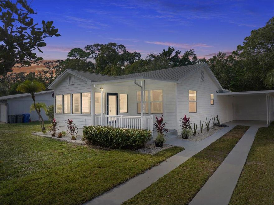 Completely reimagined and beautifully renovated, this downtown dream cottage blends modern styling with timeless character, all just 4.7 miles from the beach. With no HOA, you'll enjoy the freedom to park your boat, trailer, or extra vehicles right at home, adding lifestyle flexibility that's rare this close to town.A 2023 metal roof and impact windows provide energy efficiency, sound softening, and excellent insurance advantages, while a thoughtfully redesigned floor plan enhances openness and flow. Rich hardwood floors lead into a stunning chef inspired kitchen centered around an impressive 8+ ft quartz island, perfect for gatherings, meal prep, and bar style seating.