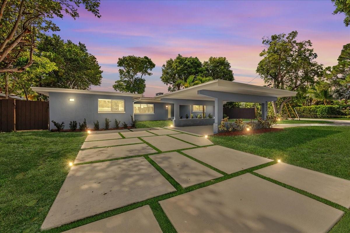 Welcome to this stunning residence in the private community of Coral Shores. This fully renovated permitted 3-bedroom, 3.5-bath home has been meticulously updated. Highlights include what appears to be a newer tile roof, impact windows and doors, elegant, tastefully designed bathrooms, and newer tile flooring throughout. Bright, open living spaces flow seamlessly to the outdoor patio and pool area. Enjoy the best of South Florida living with your own ocean-access canal-front oasis—featuring a sparkling pool, a newer deck ideal for your boat, and ample room for entertaining. A newer driveway and carport add ease and curb appeal. Just minutes from the beach, dining, shopping, cultural events, & Fort Lauderdale Airport. This Coral Shores gem truly combines modern upgrades, and timeless style,