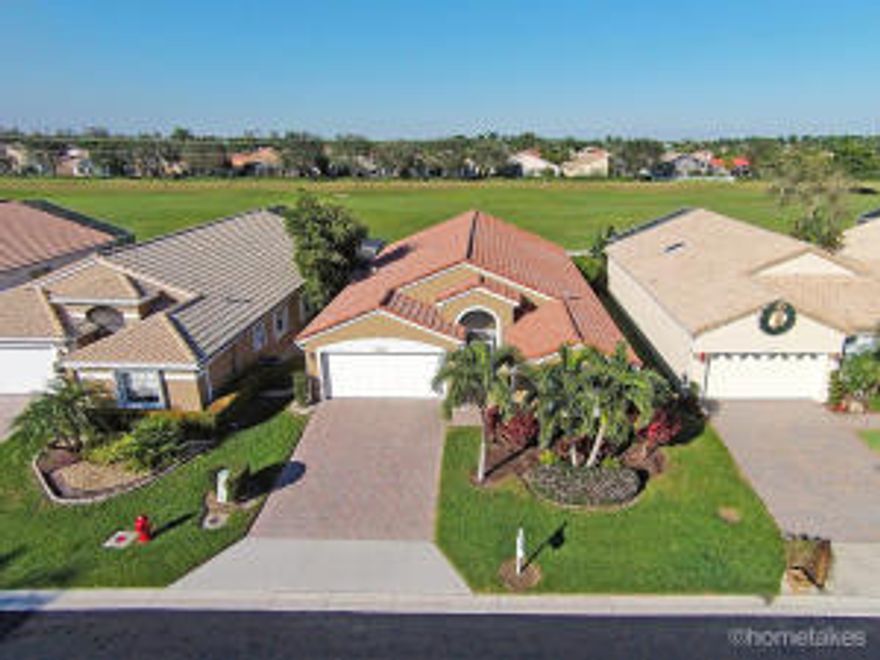Captivating fairway views accented by double French doors framing the wide open & lush green scape in your backyard.  Your new home is sited perfectly on the 6th fairway of Westchester CC - enjoy the views never worry about the fees.  The open floorplan expands your space - beautiful tile flooring in the main living areas w/rich wood grain laminate in the den and 2nd bedroom. All windows facing north are hurricane windows to ease your mind & all other windows are securely wrapped with accordion hurricane shutters. Interior decor brings you Plantation Shutters for many of your treatments - beautiful ceiling fans in every room - stainless steel kitchen appliance package.  A magnificently maintained home to call your own.