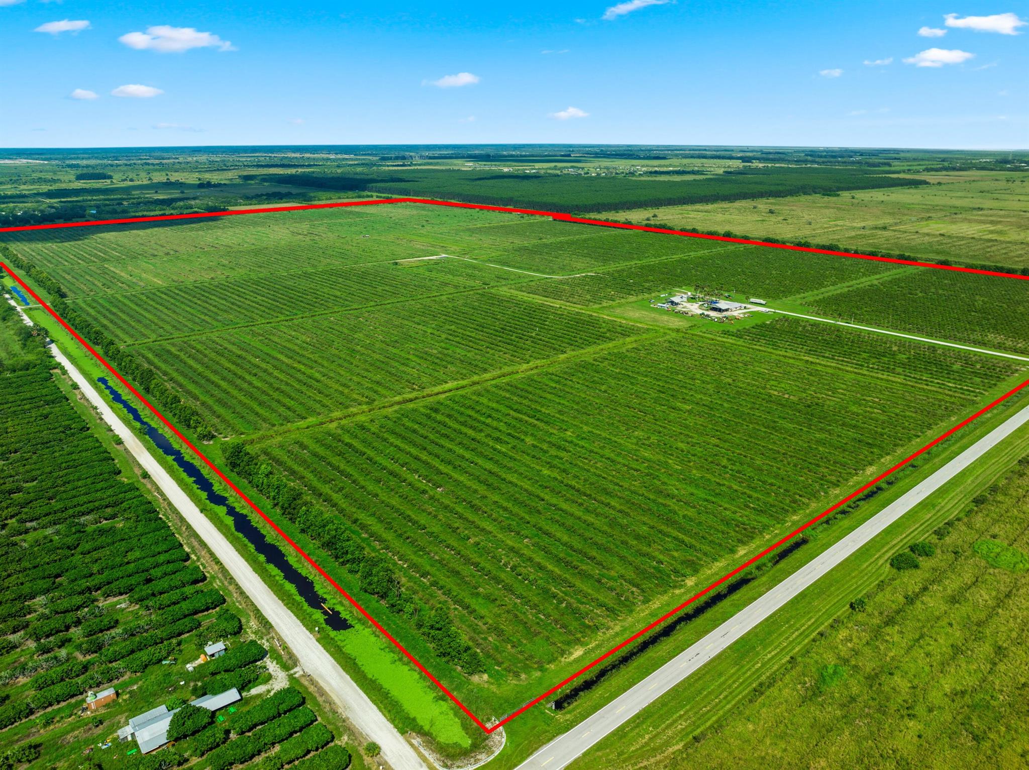 306.01 Acres, Shinn Rd and Carlton-Adams Rd's, Fort Pierce, FL (North of State Road 70, Okeechobee Road)This land's history is citrus grove production with irrigation and drainage systems in place. There are an equipment barn, caretaker's Office and Fuel Storage Tanks The land receives Agricultural Exemption for tax purposes based on the current AG business operations. The Land is located Within the North Saint Lucie Drainage District, Acreage: 310.37 AcresZoning: Ag-5 Land Use allows one unit per five acres Irrigation: MicrojetDrainage: North Saint Lucie Drainage District, Variety: Citrus Varieties, Ruby Red Grapefruit, Red Grapefruit, (Fallow Land)Improvements: Barn, Office Structure