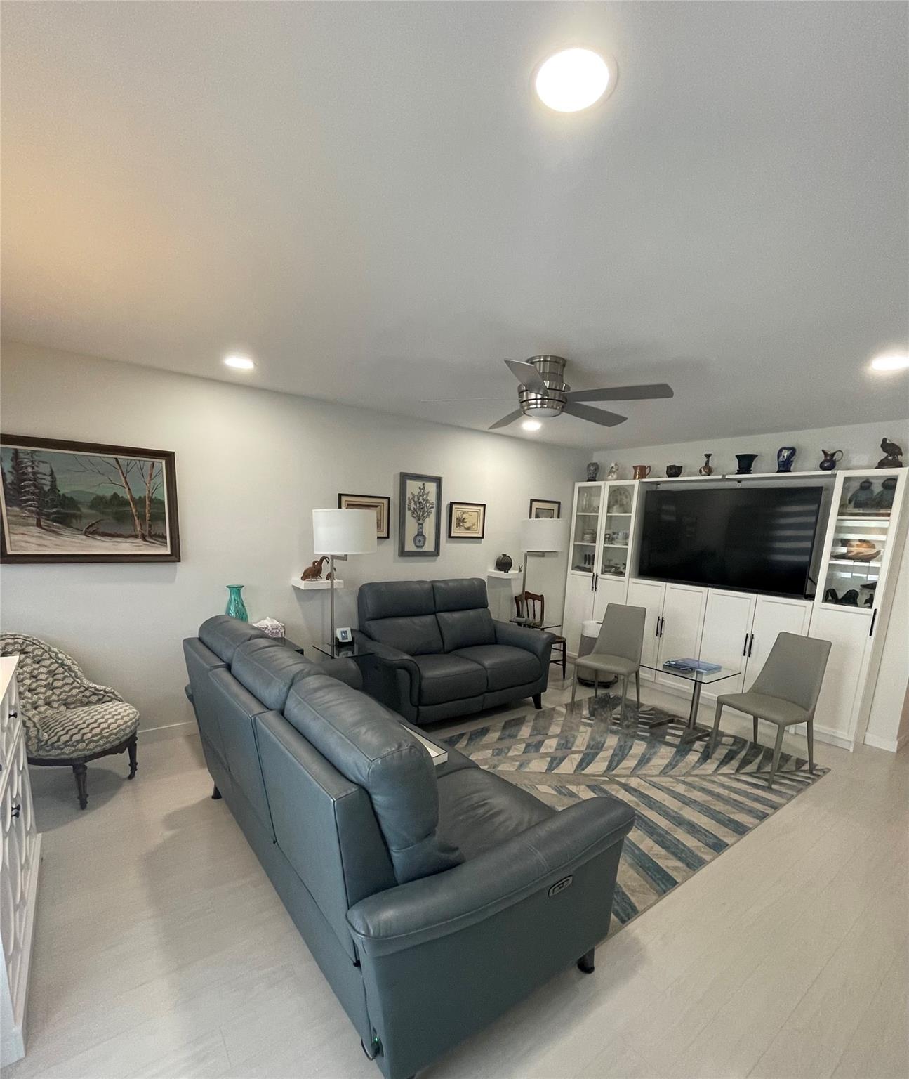 MUST SEE! FULLY RENOVATED GORGEOUS 2 bedroom, 2 bath condo in High Rise Bldg, Garden View. Located in active adult community in the heart of Deerfield Beach. Remodeled w/ Permits. HURRICANE IMPACT FRONT DOOR & WINDOWS. TONS of CUSTOM FEATURES including Hunter Douglas window shades w/ remotes. Open kitchen w/ induction cooktop, stainless steel appliances, w/ slow close cabinets. Quartz counter tops in kitchen & bathroom. Extra queen size bed on patio & murphy bed. Plenty of space for guests! His/Her closets & walk-in closet in primary bedroom. CVE offers resort style amenities including a lavish clubhouse, 1,500 seat theater, premier performances, shuttle buses, state of the art gym, pickleball, tennis, pools, movies & classes. Close to shopping, restaurants & beach. Assoc claims 55+.